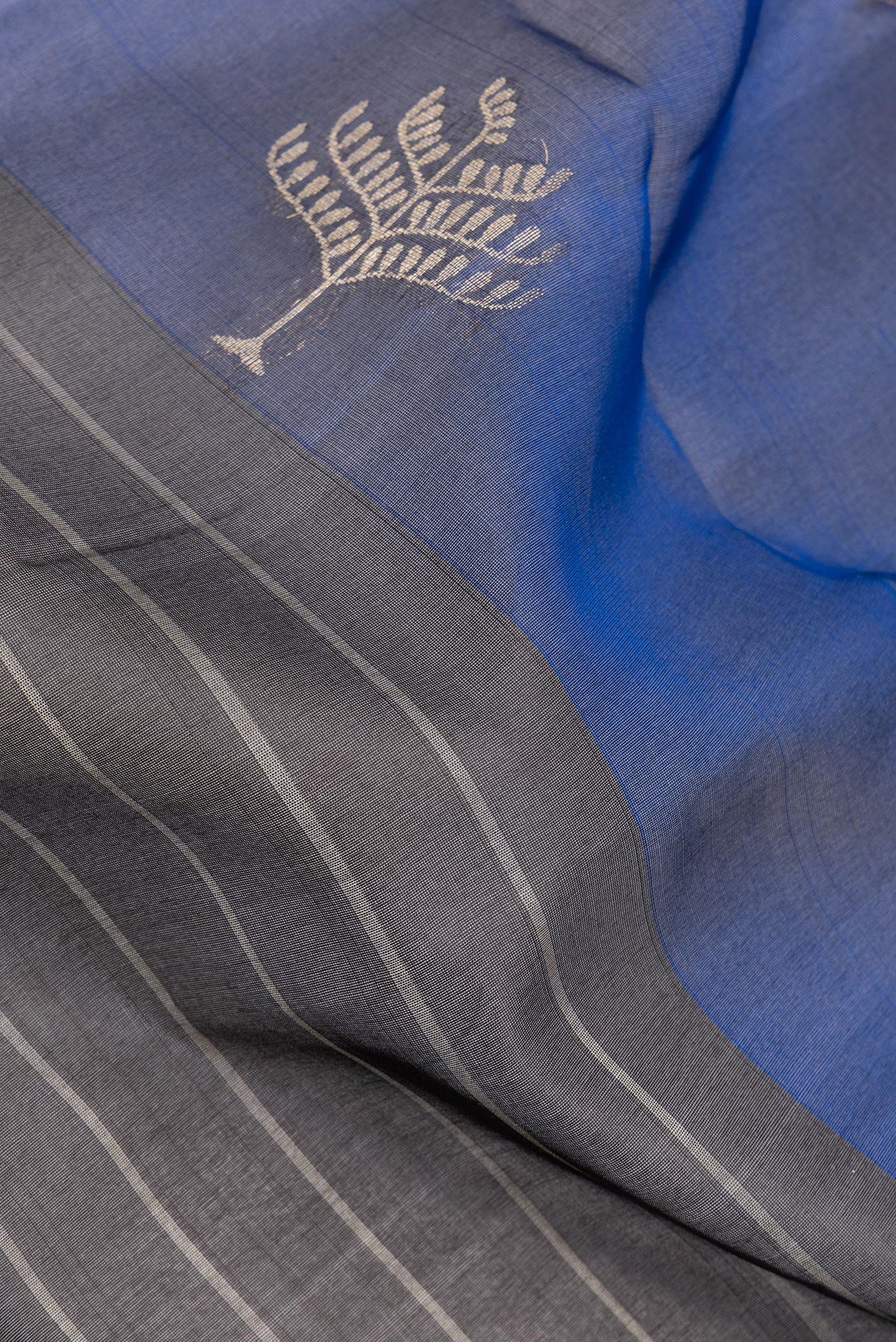 Close up of Pure Silk Black Dual Tone Tussar Saree with Stripes on the body and Ganga Jamuna Border.  displaying folds