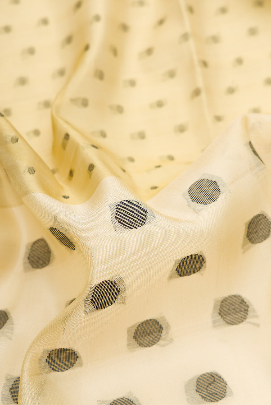 Close up of Pure Silk Sandal Soft Saree with Thread Butta on the body and Without Border.  displaying folds
