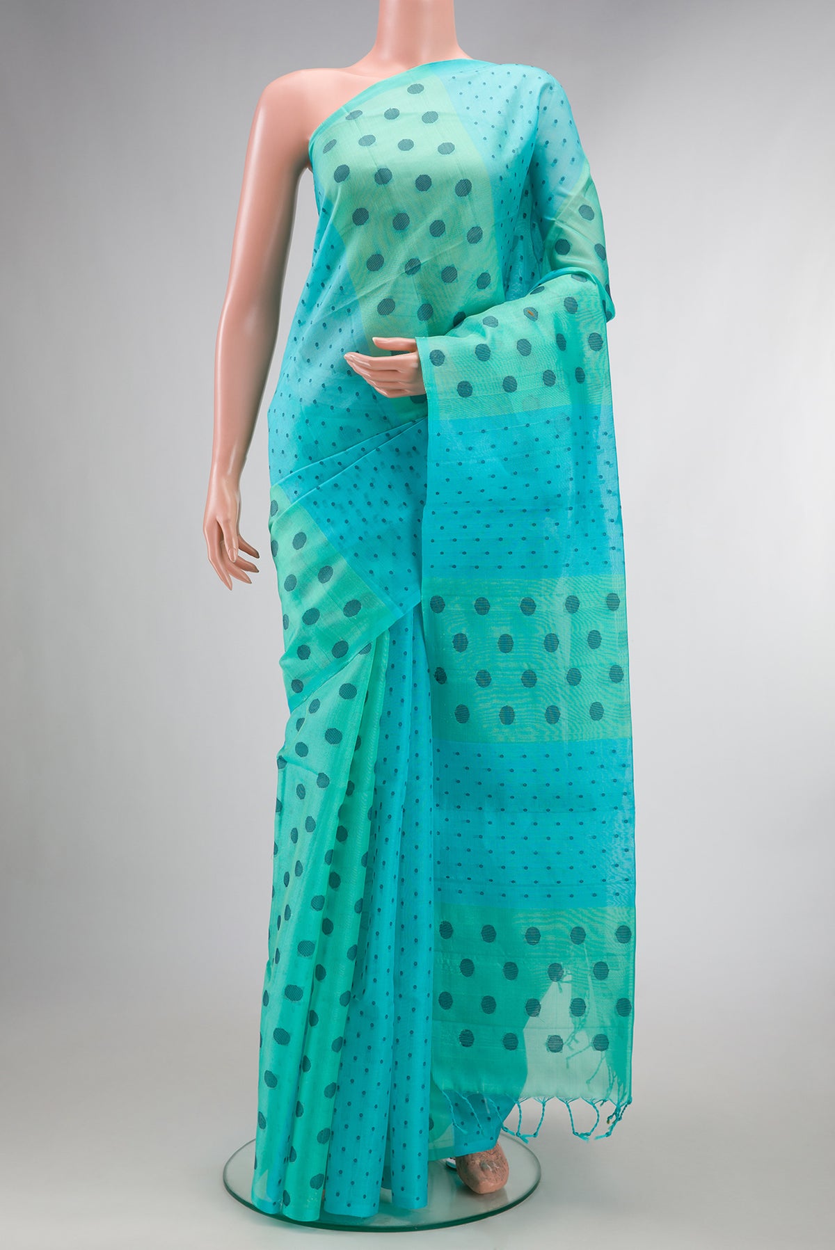 Pure Silk Multi Color Soft Saree with Thread Butta on the body and Without Border.  displayed on a mannequin