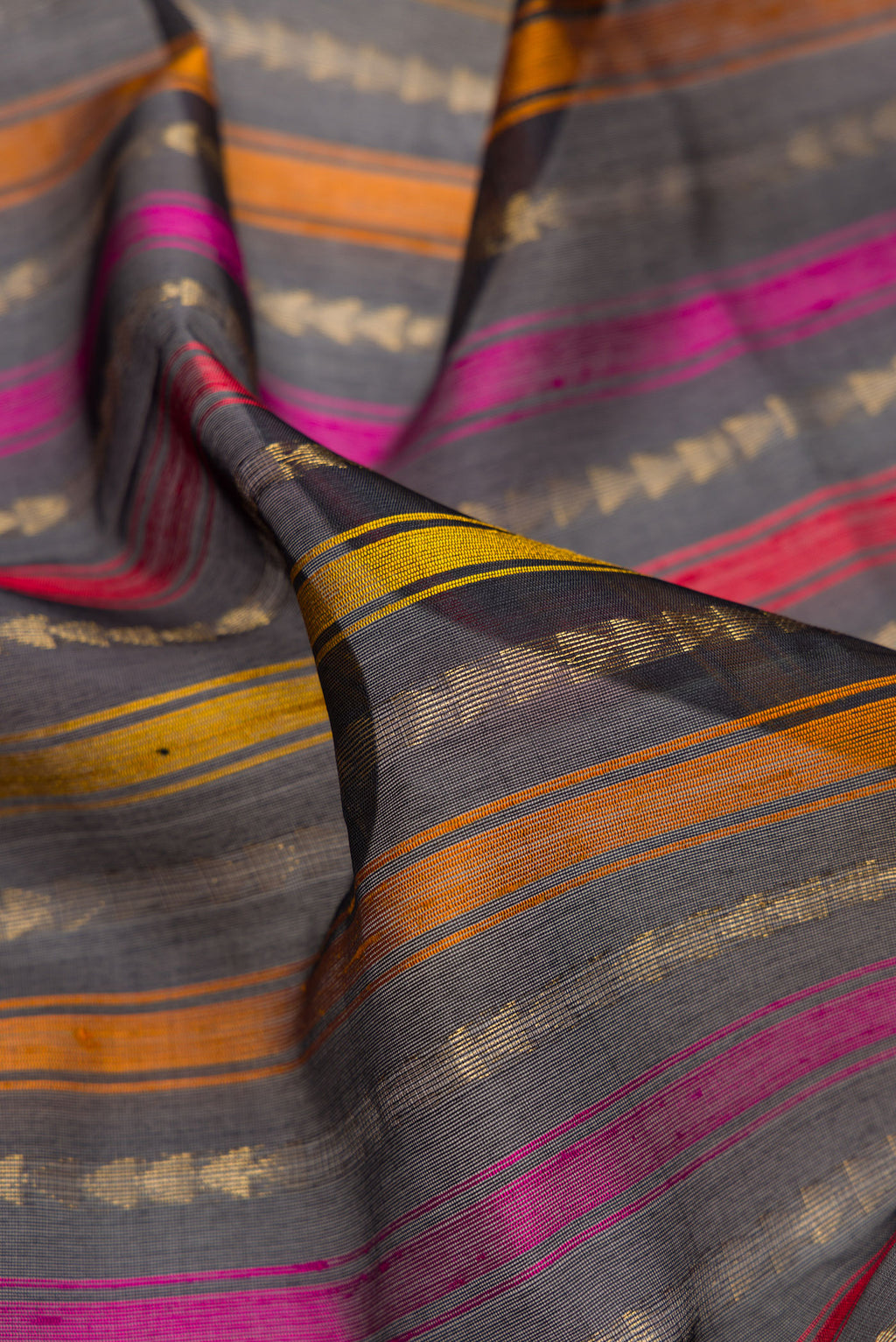 Close up of Black Tussar Saree with Stripes on the body and Without Border.  displaying folds