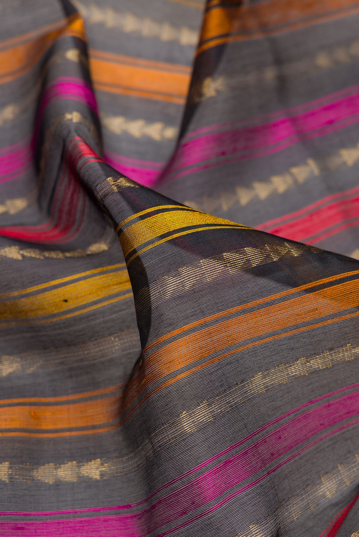 Close up of Black Tussar Saree with Stripes on the body and Without Border.  displaying folds