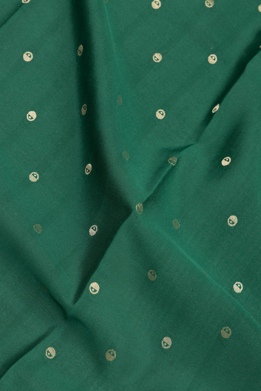 Close up of Pure Silk Bottle Green Dual Tone Mysore Silk Saree with Zari Butta on the body and Zari Border.  displaying folds