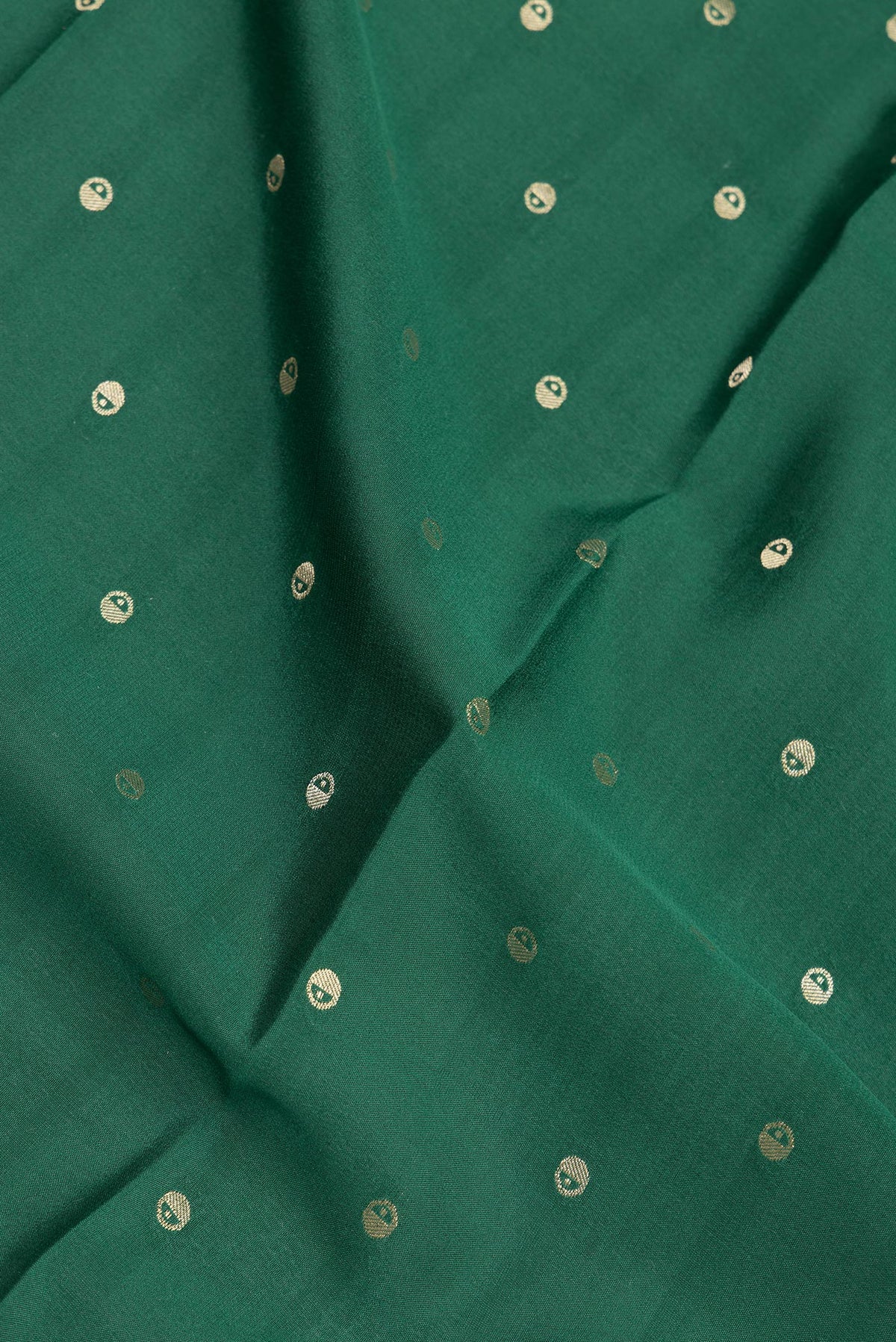 Close up of Pure Silk Bottle Green Dual Tone Mysore Silk Saree with Zari Butta on the body and Zari Border.  displaying folds