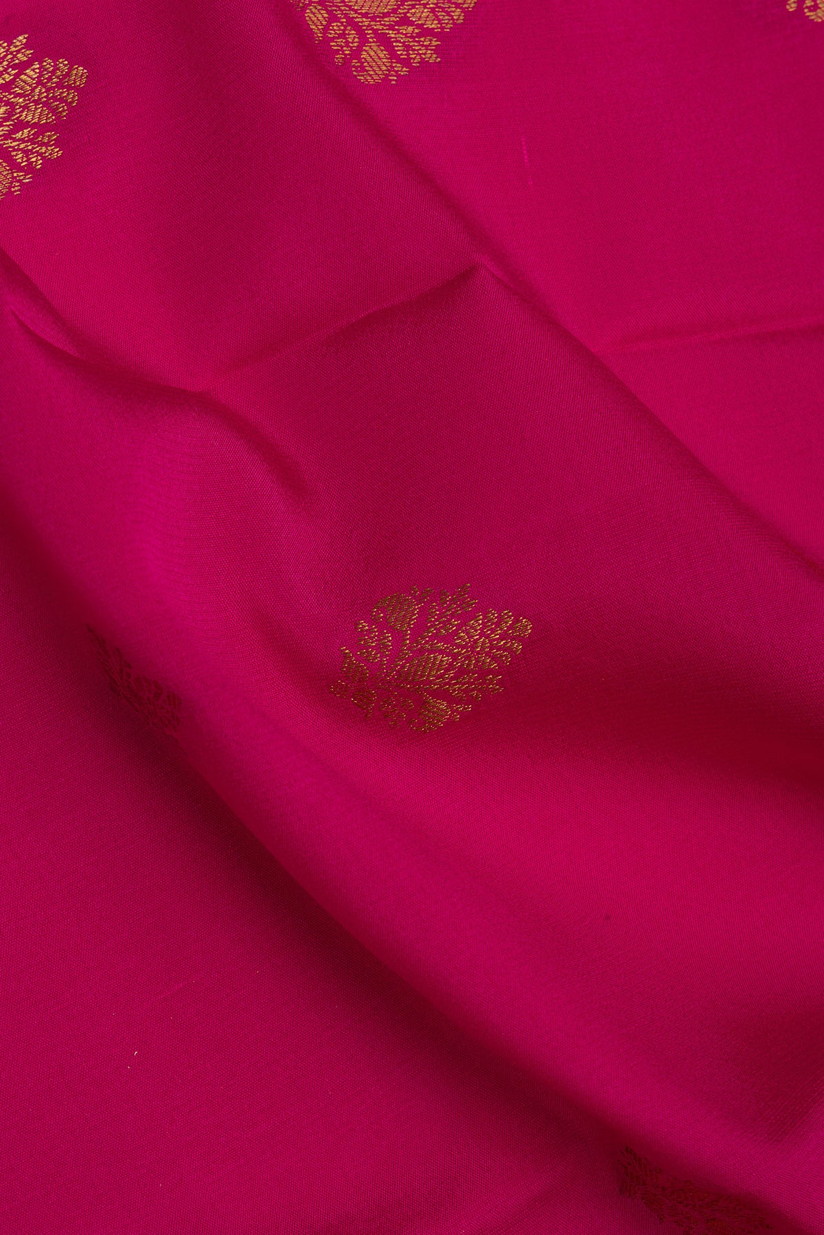 Close up of Dark Pink Mysore Crepe Saree with Zari Butta on the body and Zari Border.  displaying folds