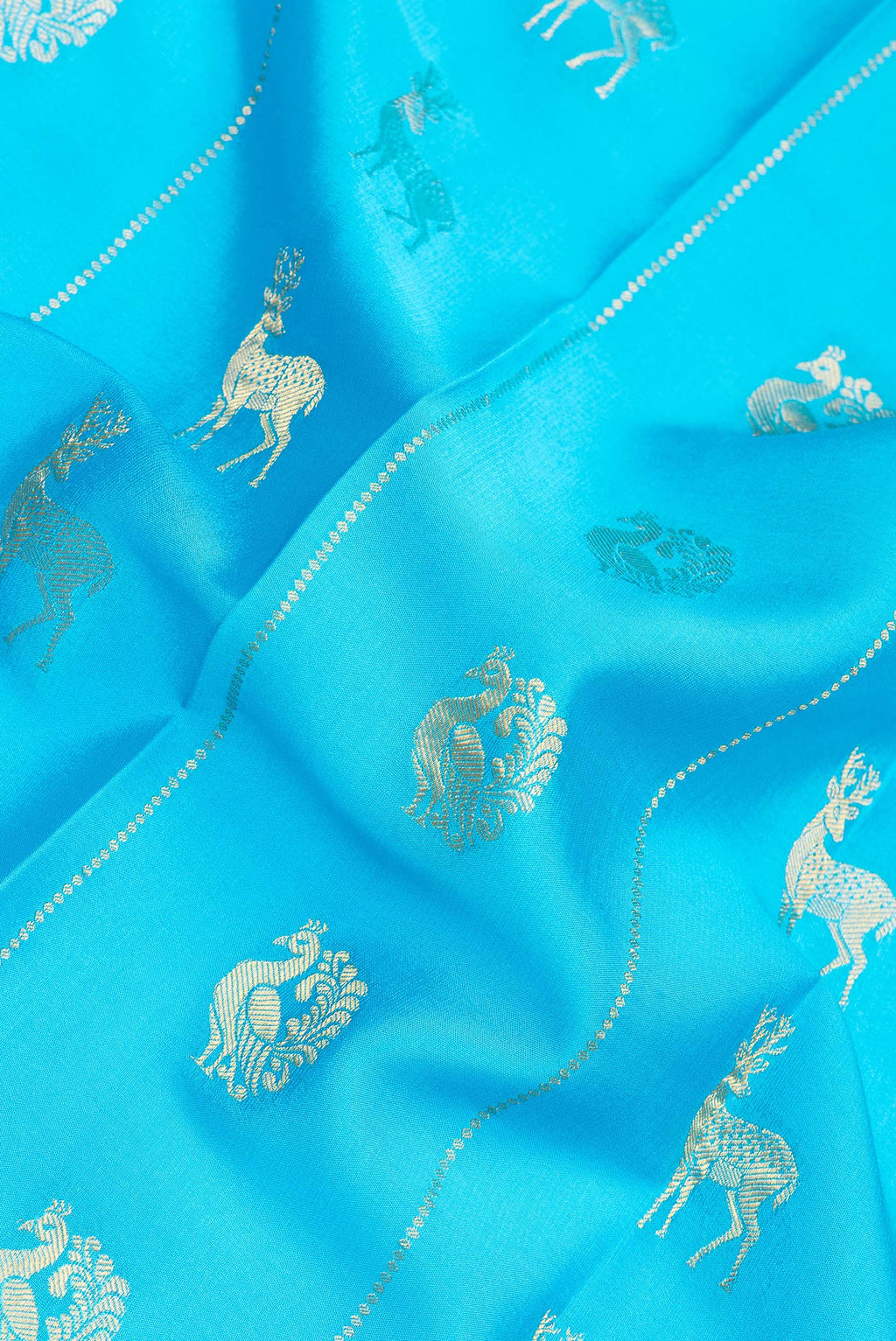 Close up of Pure Silk Sky Blue Dual Tone Mysore Silk Saree with Zari Butta on the body and Zari Border.  displaying folds
