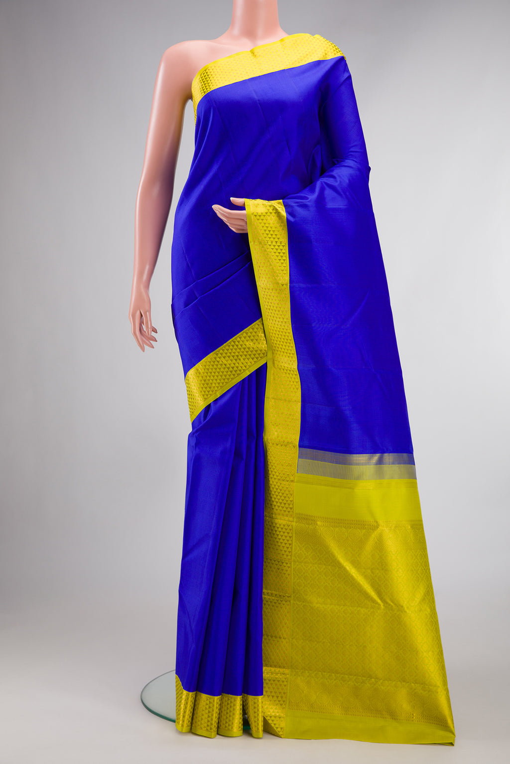 Pure Silk Royal Blue Kanjivaram Saree with Plain Body and Zari Border.  displayed on a mannequin