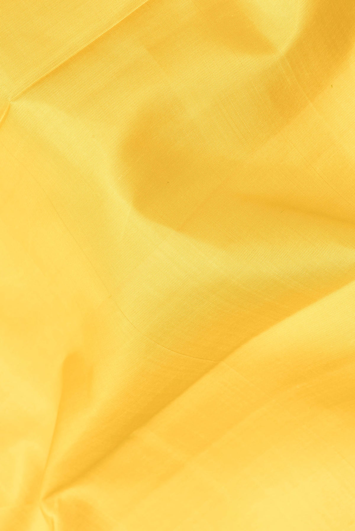 Close up of Pure Silk Mustard Dual Tone Kanjivaram Saree with Plain Body and Temple Border.  displaying folds
