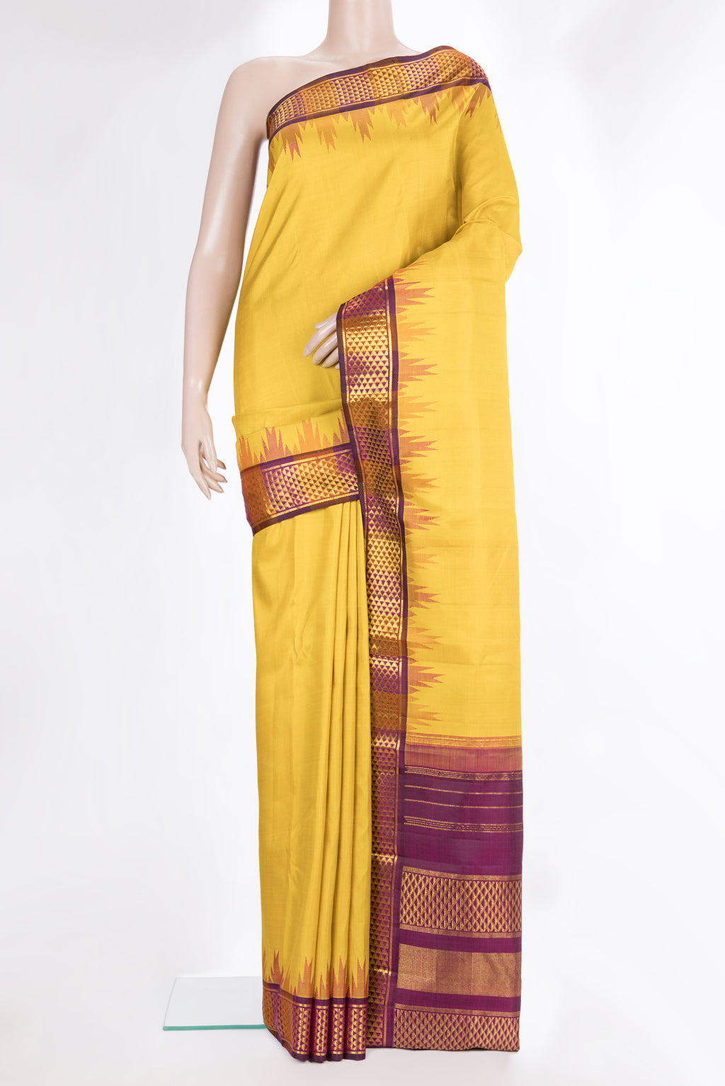 Pure Silk Mustard Dual Tone Kanjivaram Saree with Plain Body and Temple Border.  displayed on a mannequin