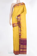 Pure Silk Mustard Dual Tone Kanjivaram Saree with Plain Body and Temple Border.  displayed on a mannequin