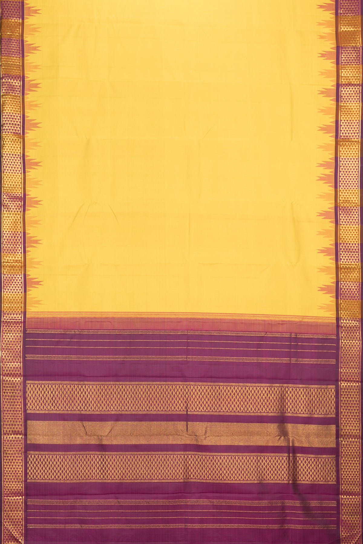 Flat view of Pure Silk Mustard Dual Tone Kanjivaram Saree with Plain Body and Temple Border. 