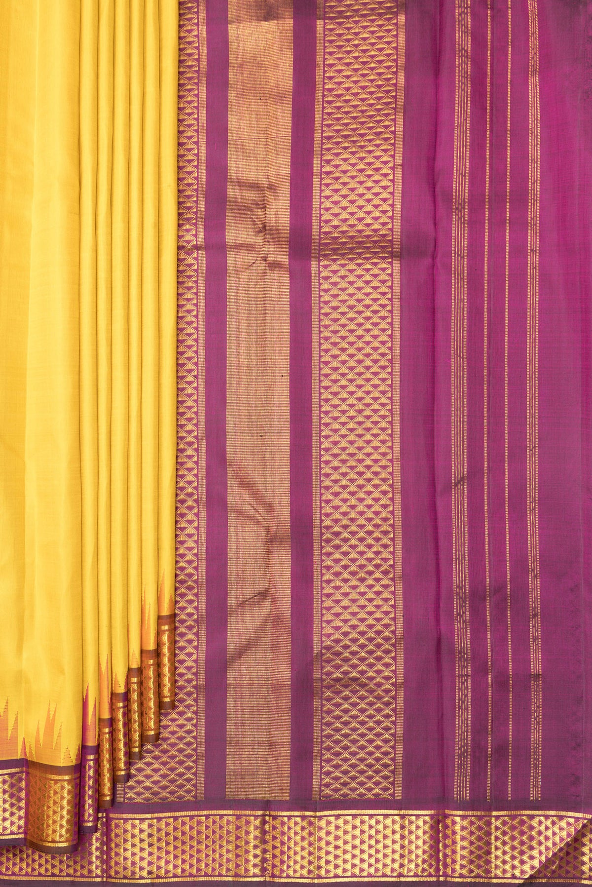 Pleats and pallu of Pure Silk Mustard Dual Tone Kanjivaram Saree with Plain Body and Temple Border. 