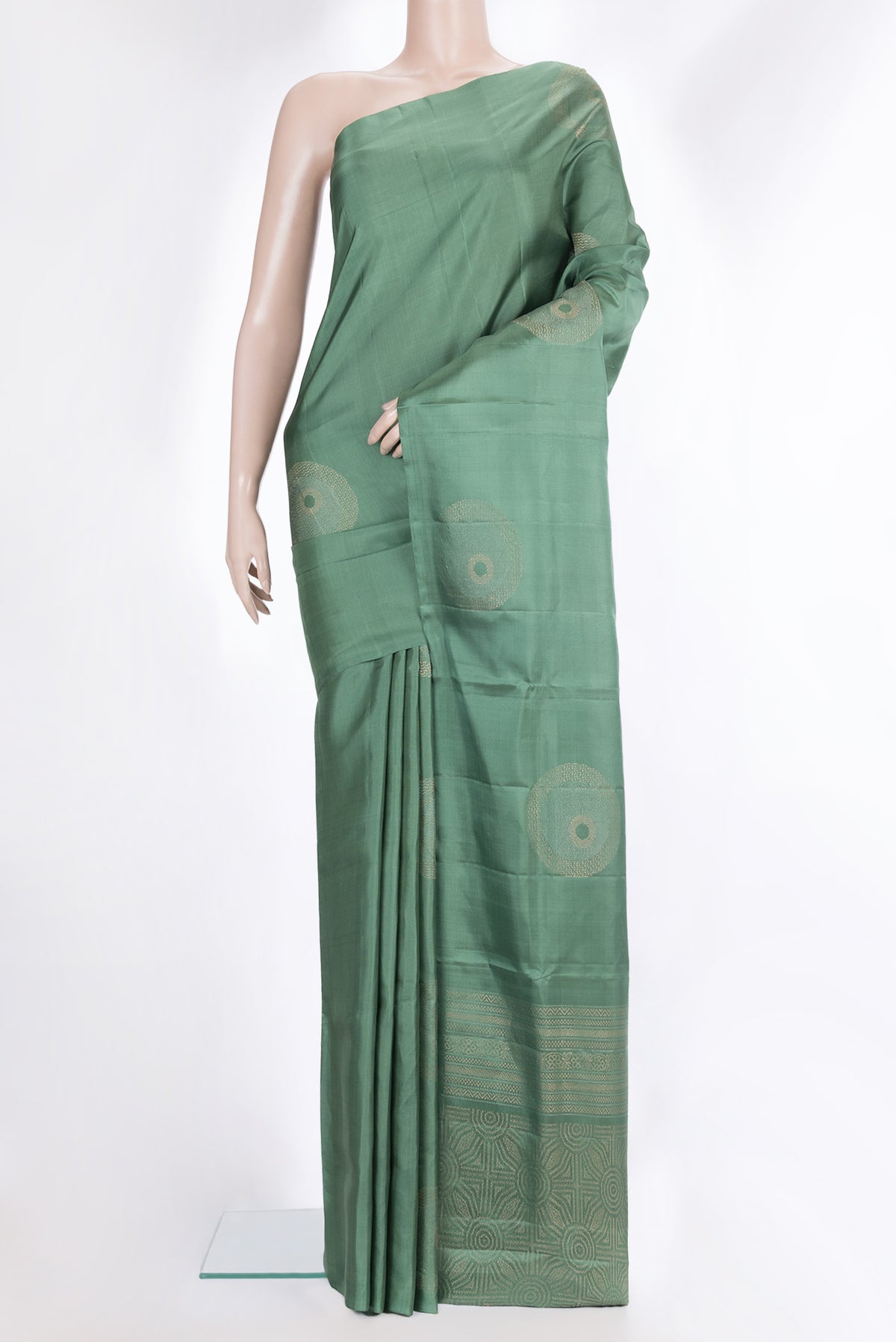 Pure Silk Green Dual Tone Soft Saree with Zari Butta on the body and Without Border.  displayed on a mannequin