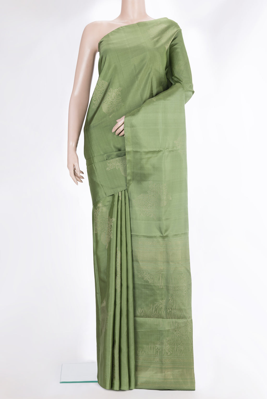 Pure Silk Green Dual Tone Soft Saree with Zari Butta on the body and Without Border.  displayed on a mannequin
