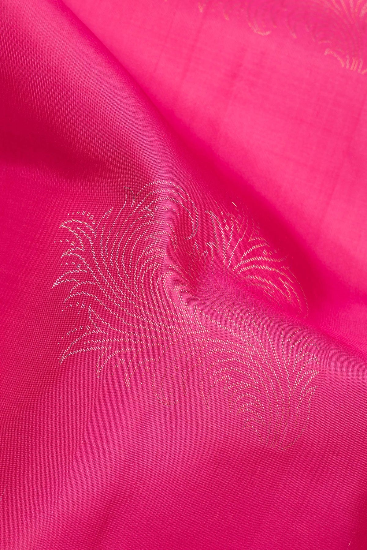 Close up of Pure Silk Dark Pink Dual Tone Soft Saree with Zari Butta on the body and Without Border.  displaying folds