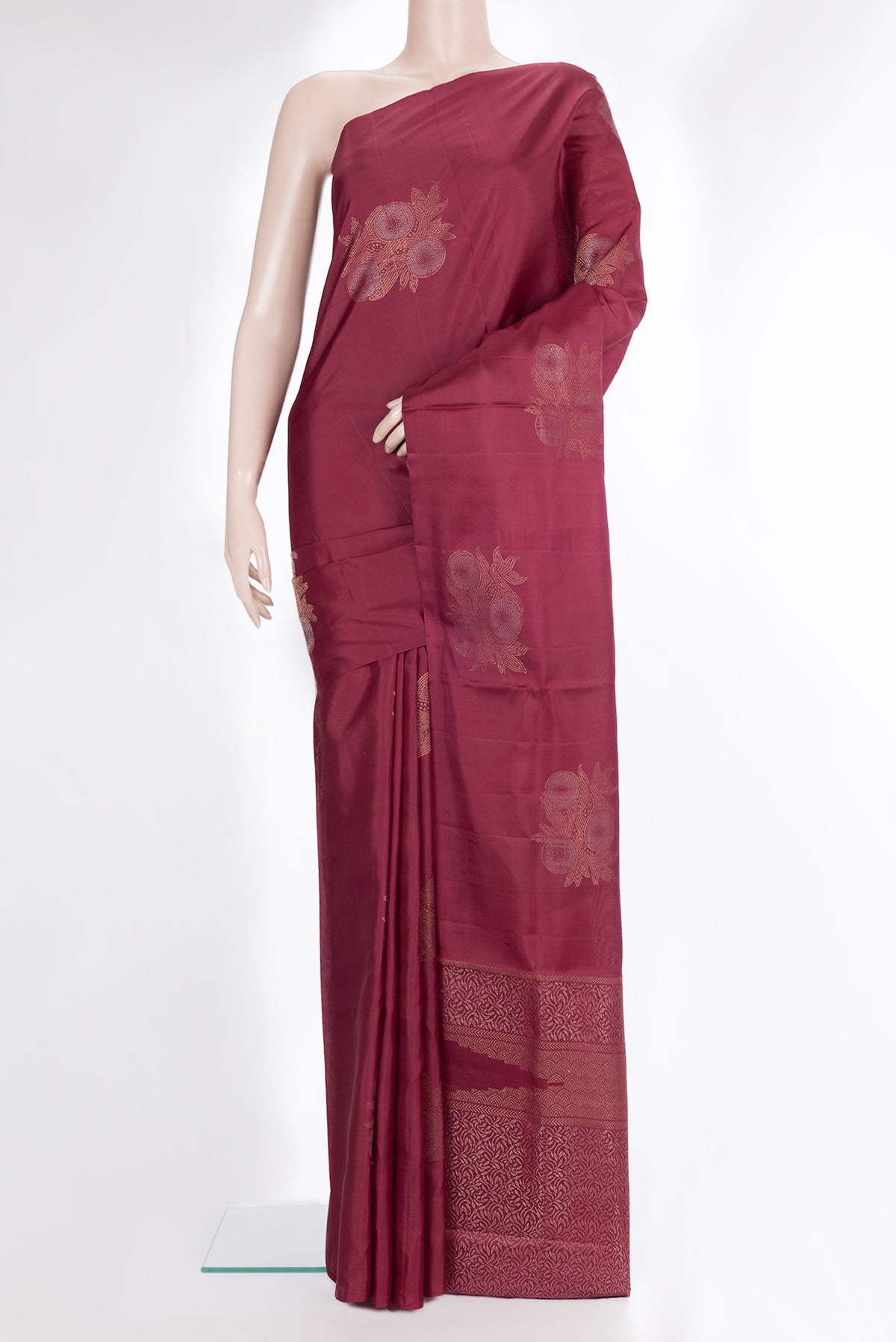 Pure Silk Maroon Dual Tone Soft Saree with Zari Butta on the body and Without Border.  displayed on a mannequin