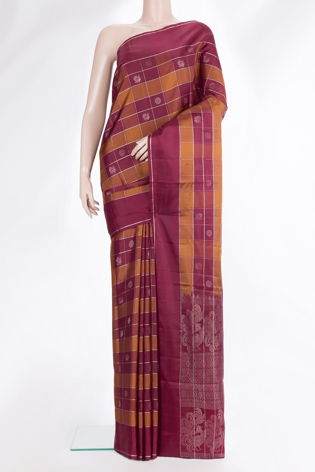 Pure Silk Maroon Dual Tone Soft Saree with Checked design on the body and Zari Border.  displayed on a mannequin