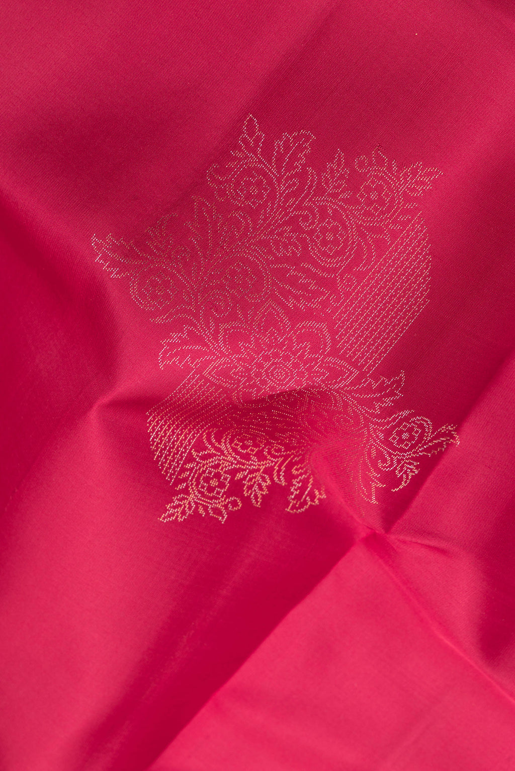 Close up of Pure Silk Dark Pink Dual Tone Soft Saree with Zari Butta on the body and Without Border.  displaying folds