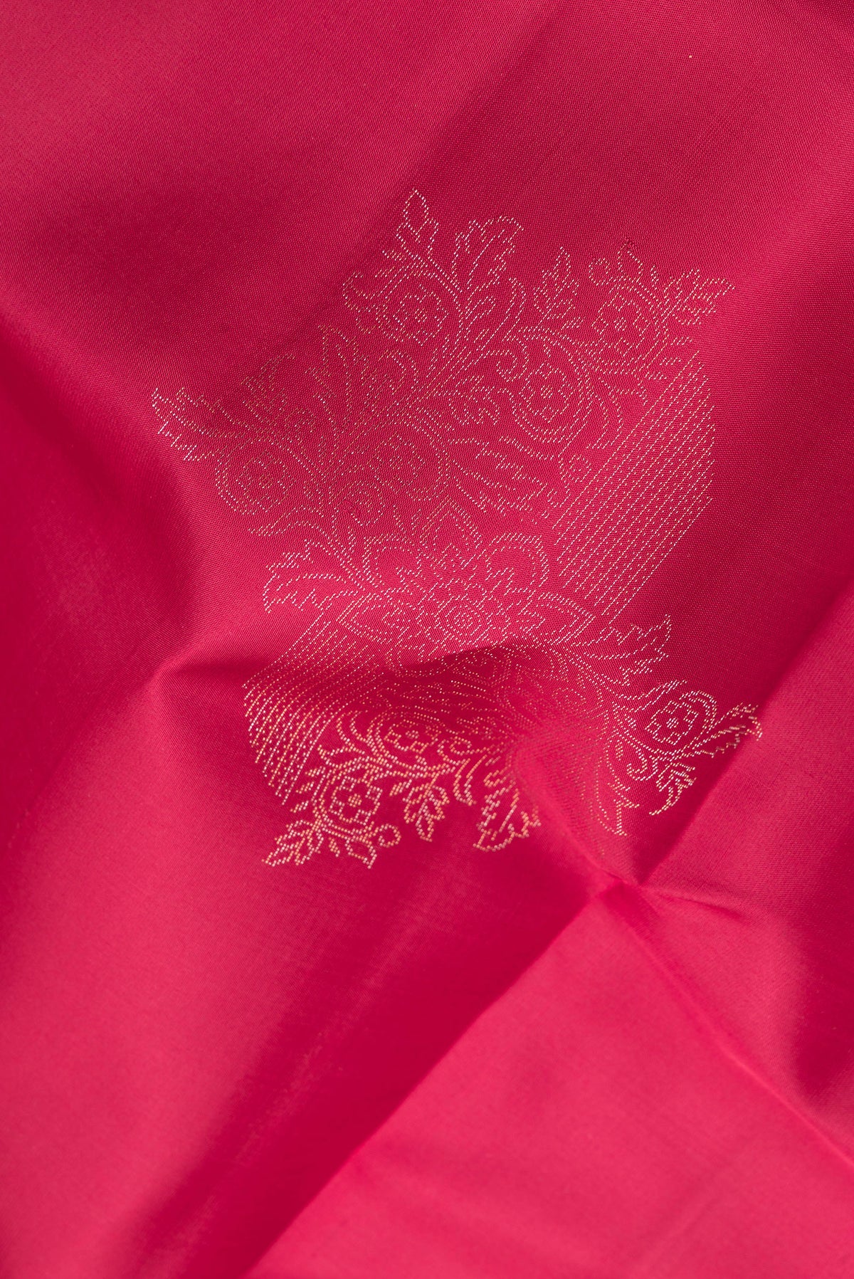 Close up of Pure Silk Dark Pink Dual Tone Soft Saree with Zari Butta on the body and Without Border.  displaying folds