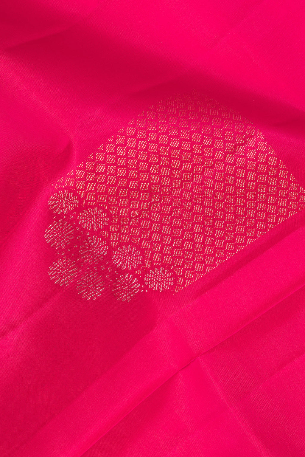 Close up of Pure Silk Dark Pink Dual Tone Soft Saree with Zari Butta on the body and Without Border.  displaying folds