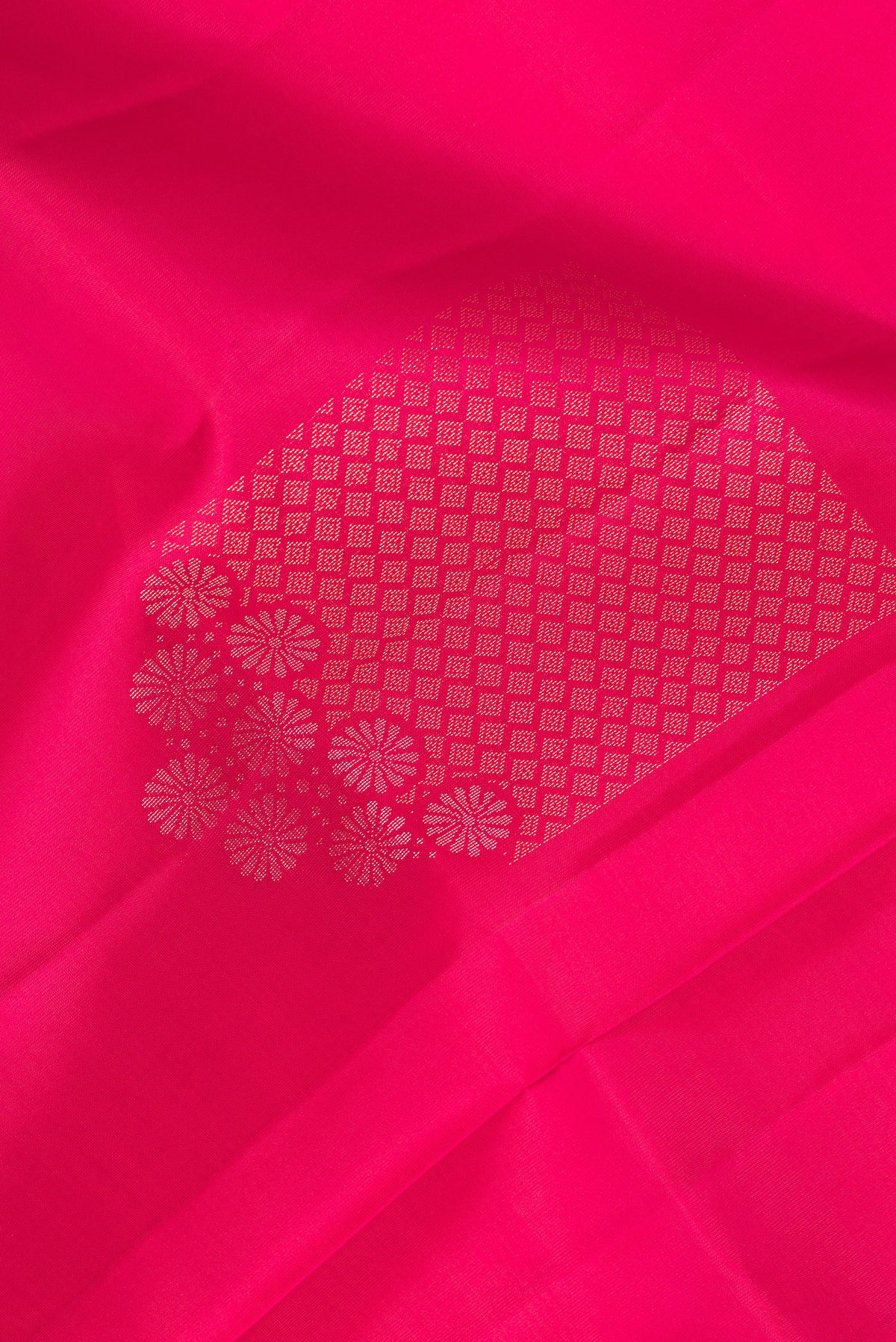 Close up of Pure Silk Dark Pink Dual Tone Soft Saree with Zari Butta on the body and Without Border.  displaying folds