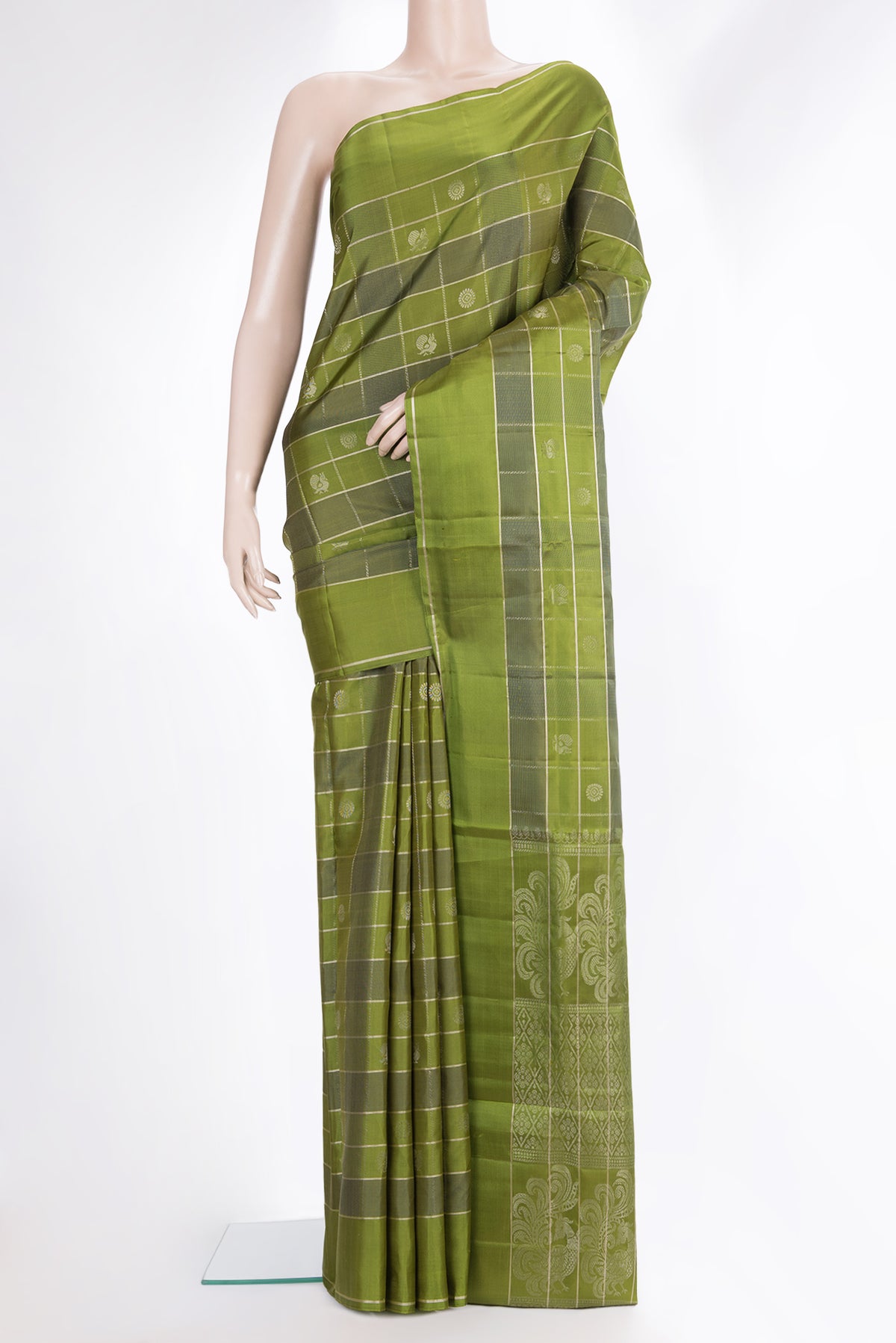 Pure Silk Mehandi Green Dual Tone Soft Saree with Checked design on the body and Zari Border.  displayed on a mannequin