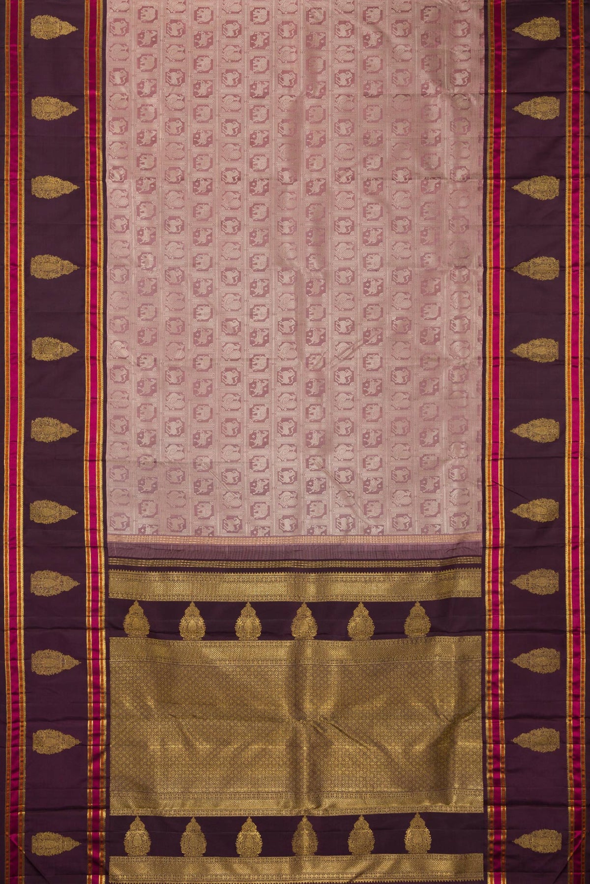 Flat view of Pure Silk Pure Zari Mauve Kanjivaram Saree with Zari Brocade on the body and Fancy Border. 