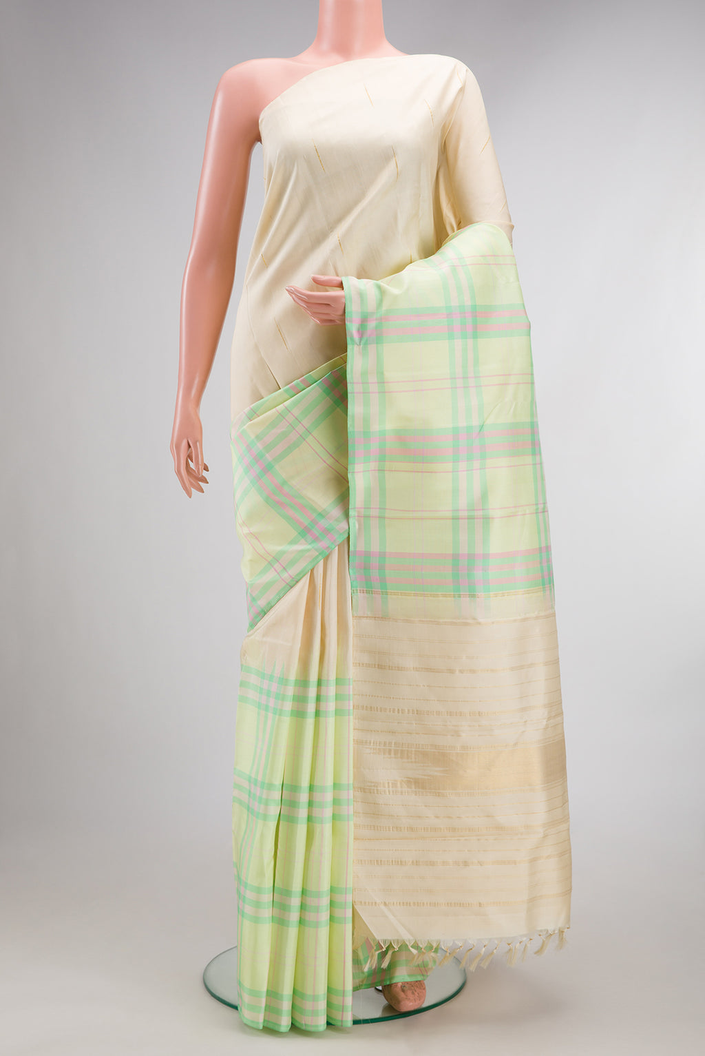 Pure Silk Light Green and Sandal Color Kanjivaram Saree with Half And Half on the body and Without Border.  displayed on a mannequin