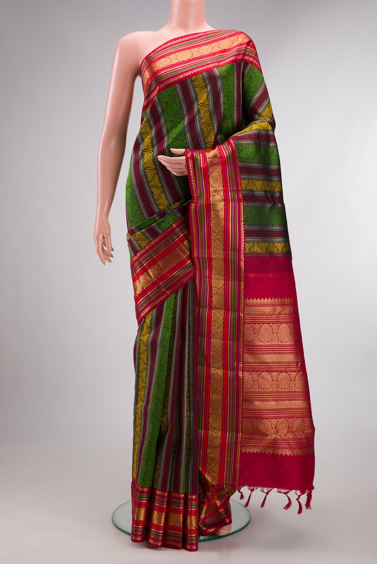 Pure Silk Multi Color Kanchipuram Saree with Jacquard design on the body and Zari And Thread Border.  displayed on a mannequin