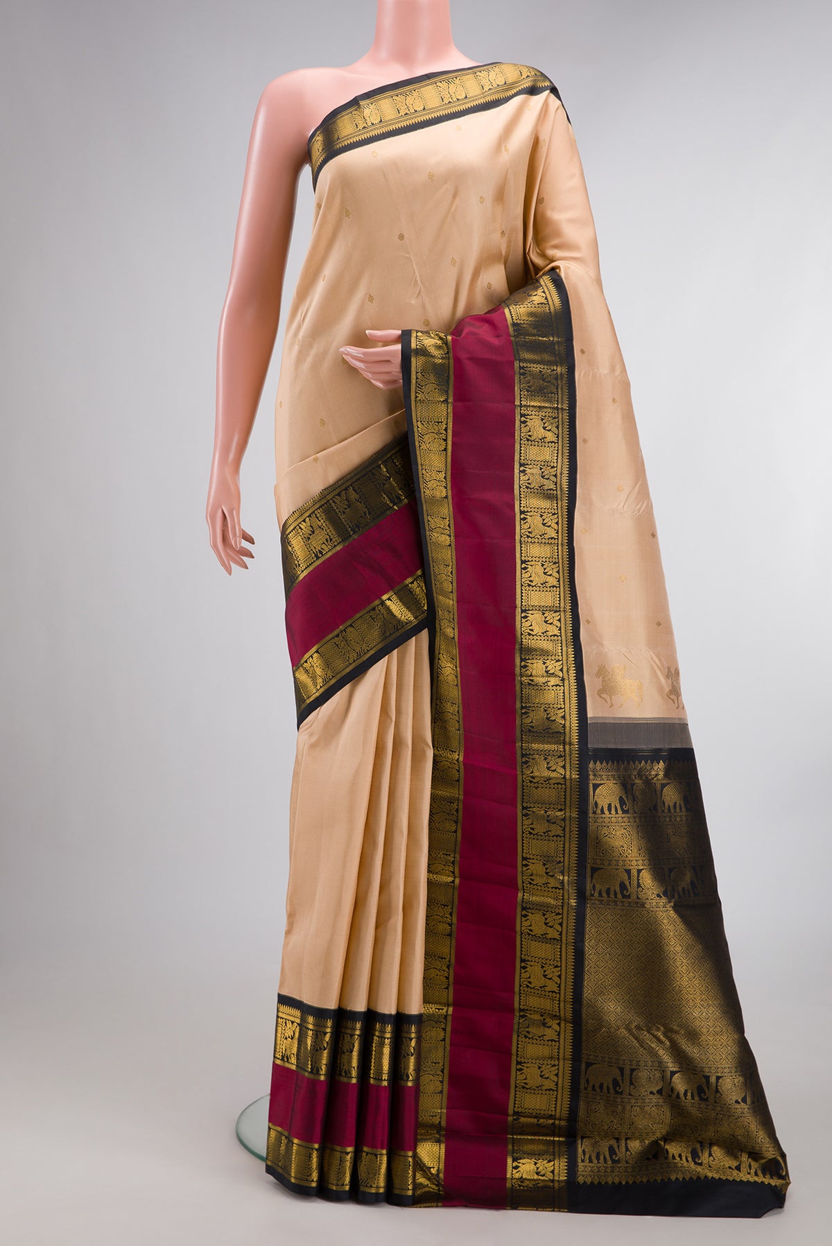 Pure Silk Sandal Kanchipuram Saree with Zari Butta on the body and Fancy Border.  displayed on a mannequin