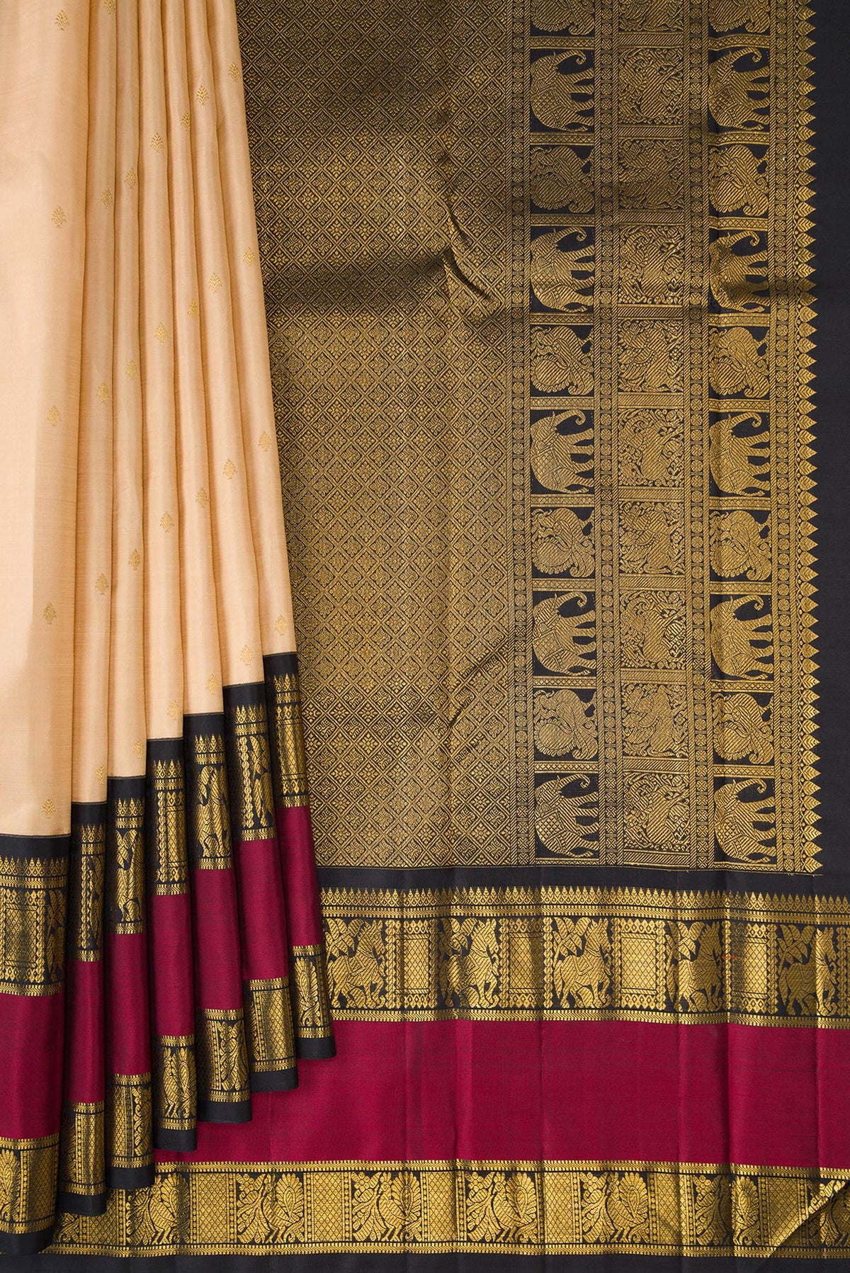 Pleats and pallu of Pure Silk Sandal Kanchipuram Saree with Zari Butta on the body and Fancy Border. 