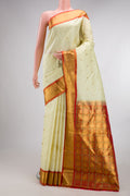 Pure Silk Cream Kanjivaram Saree with Checked design on the body and Zari Border.  displayed on a mannequin