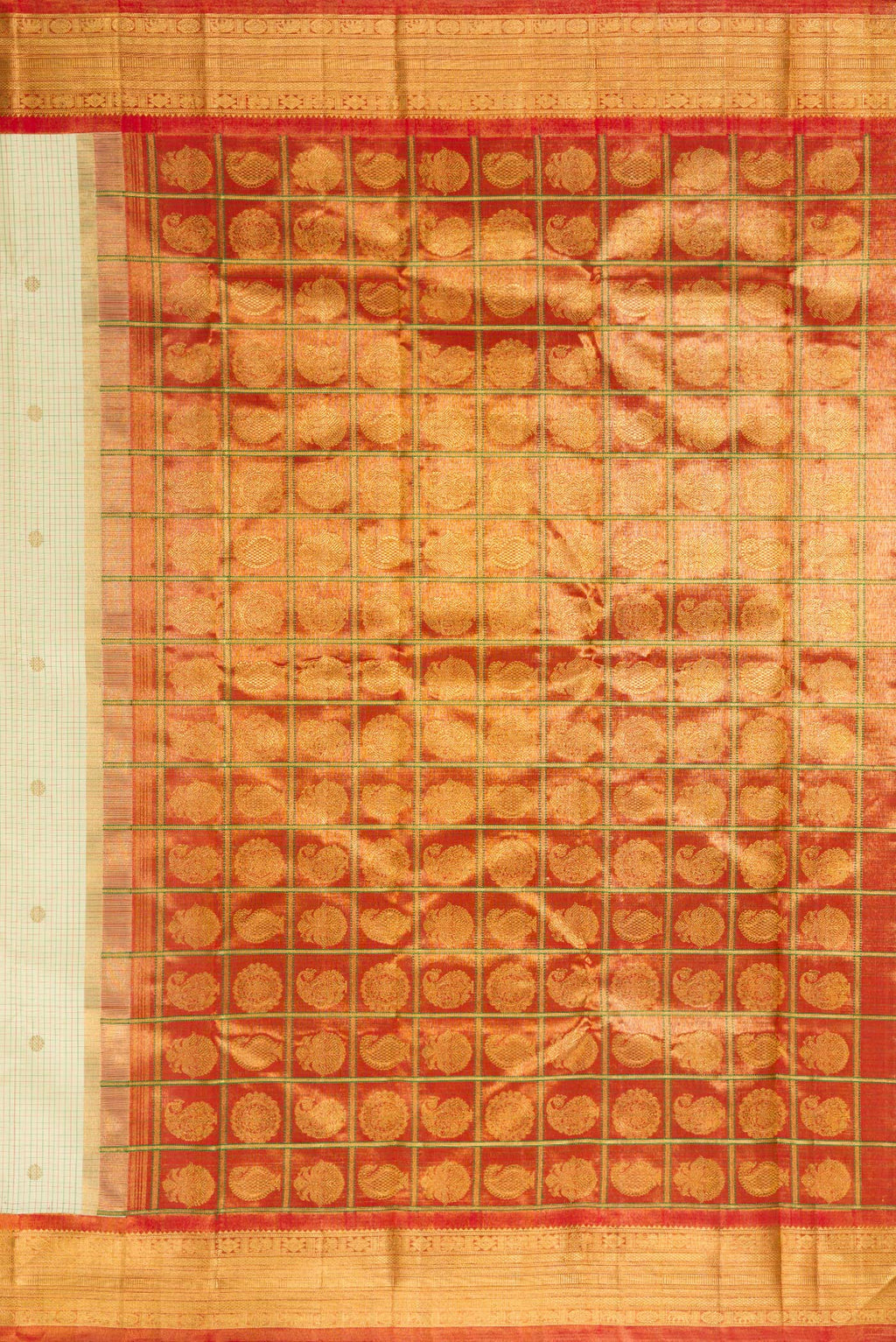 Close up image of the pallu of Pure Silk Cream Kanjivaram Saree with Checked design on the body and Zari Border. 