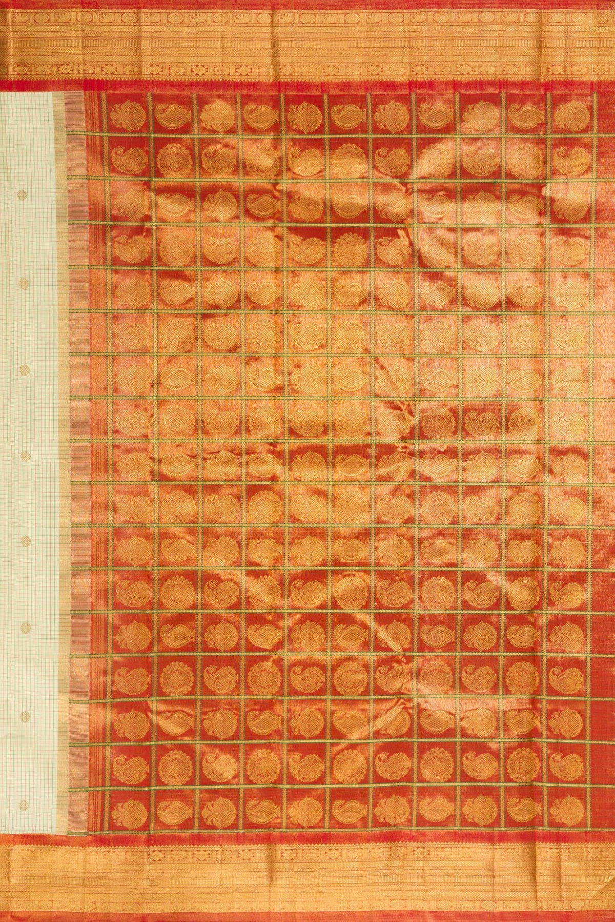 Close up image of the pallu of Pure Silk Cream Kanjivaram Saree with Checked design on the body and Zari Border. 