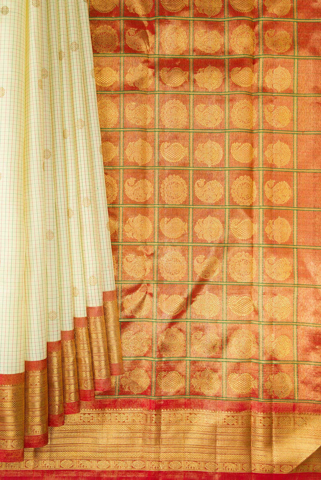 Pleats and pallu of Pure Silk Cream Kanjivaram Saree with Checked design on the body and Zari Border. 
