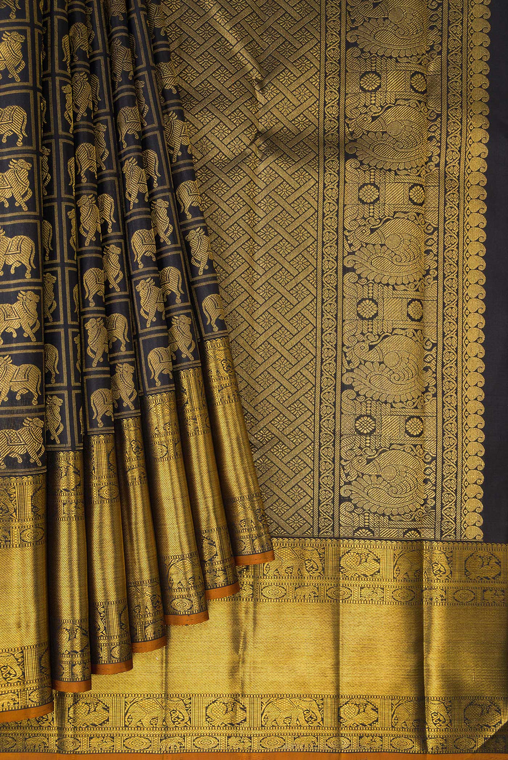Pleats and pallu of Pure Silk Black Dual Tone Kanchipuram Saree with Checked design on the body and Zari Border. 