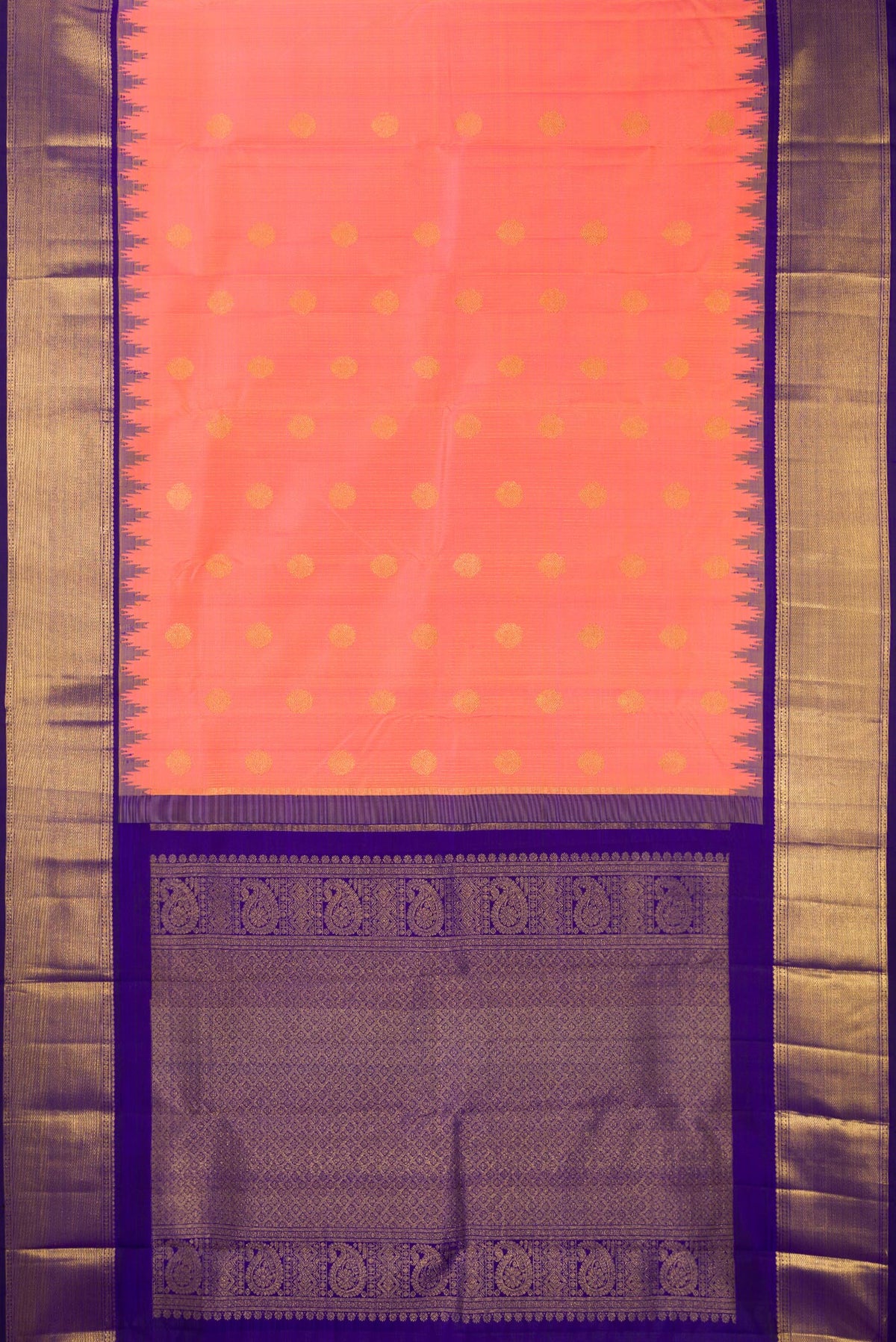 Flat view of Pure Silk Peach Kanchipuram Saree with Zari Butta on the body and Temple Border. 
