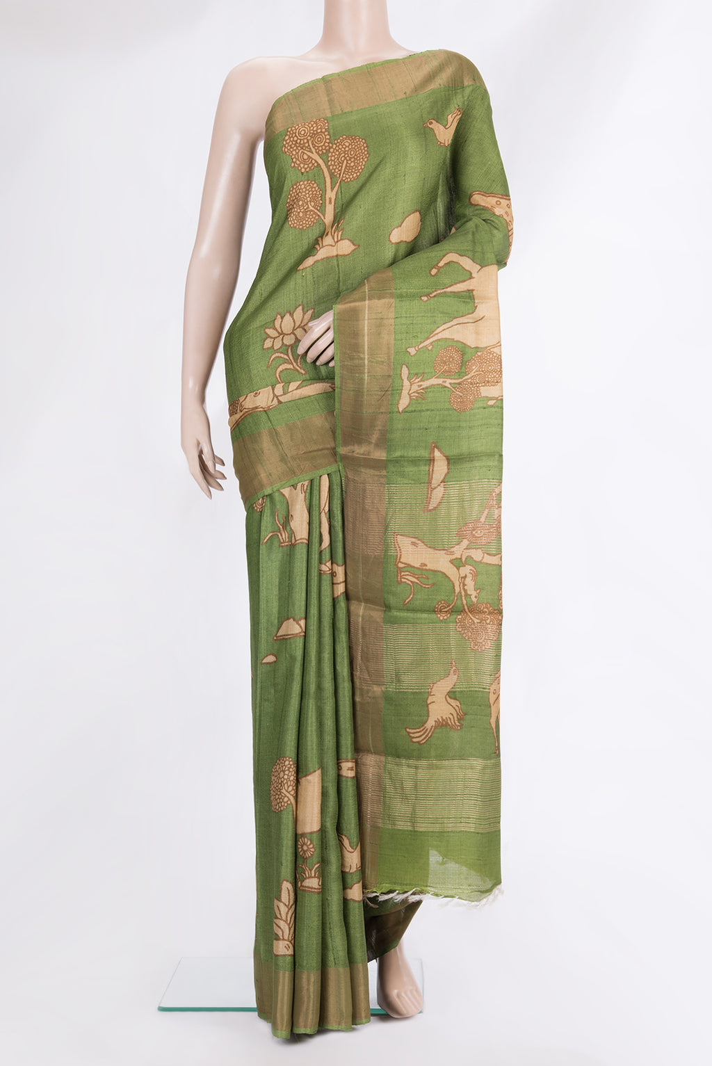 Mehandi Green Tussar Saree with Printed design on the body and Zari Border.  displayed on a mannequin
