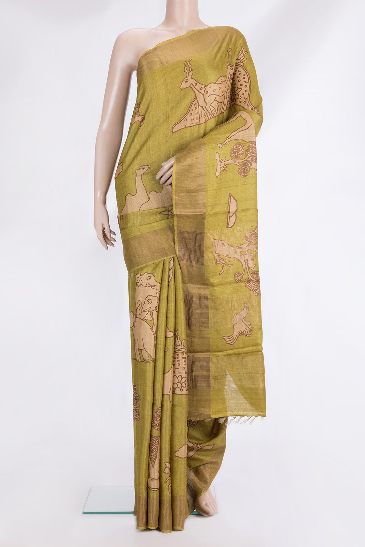 Pure Silk Mustard Tussar Saree with Printed design on the body and Zari Border.  displayed on a mannequin