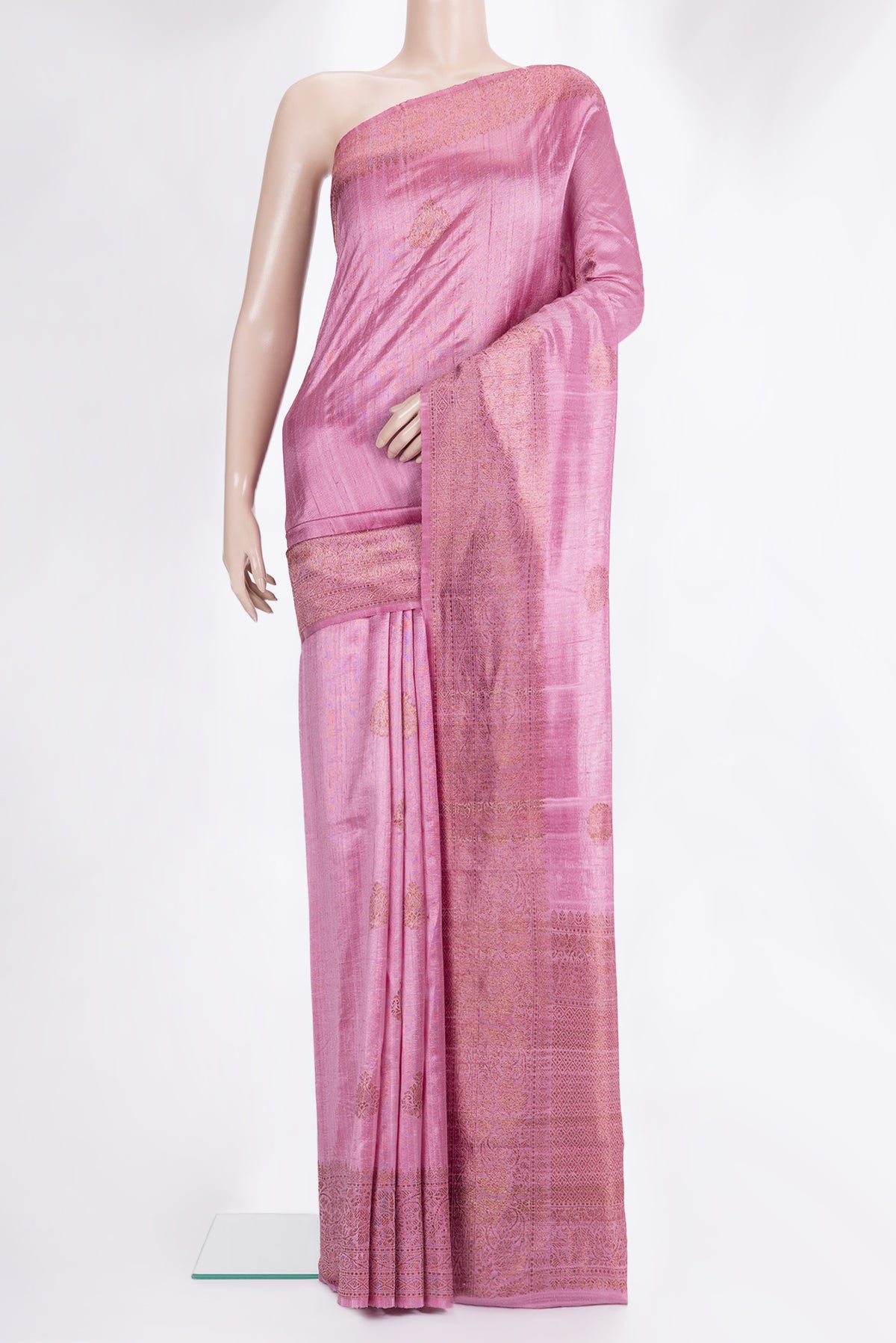 Pink Raw Saree with Zari Butta on the body and Zari Border.  displayed on a mannequin