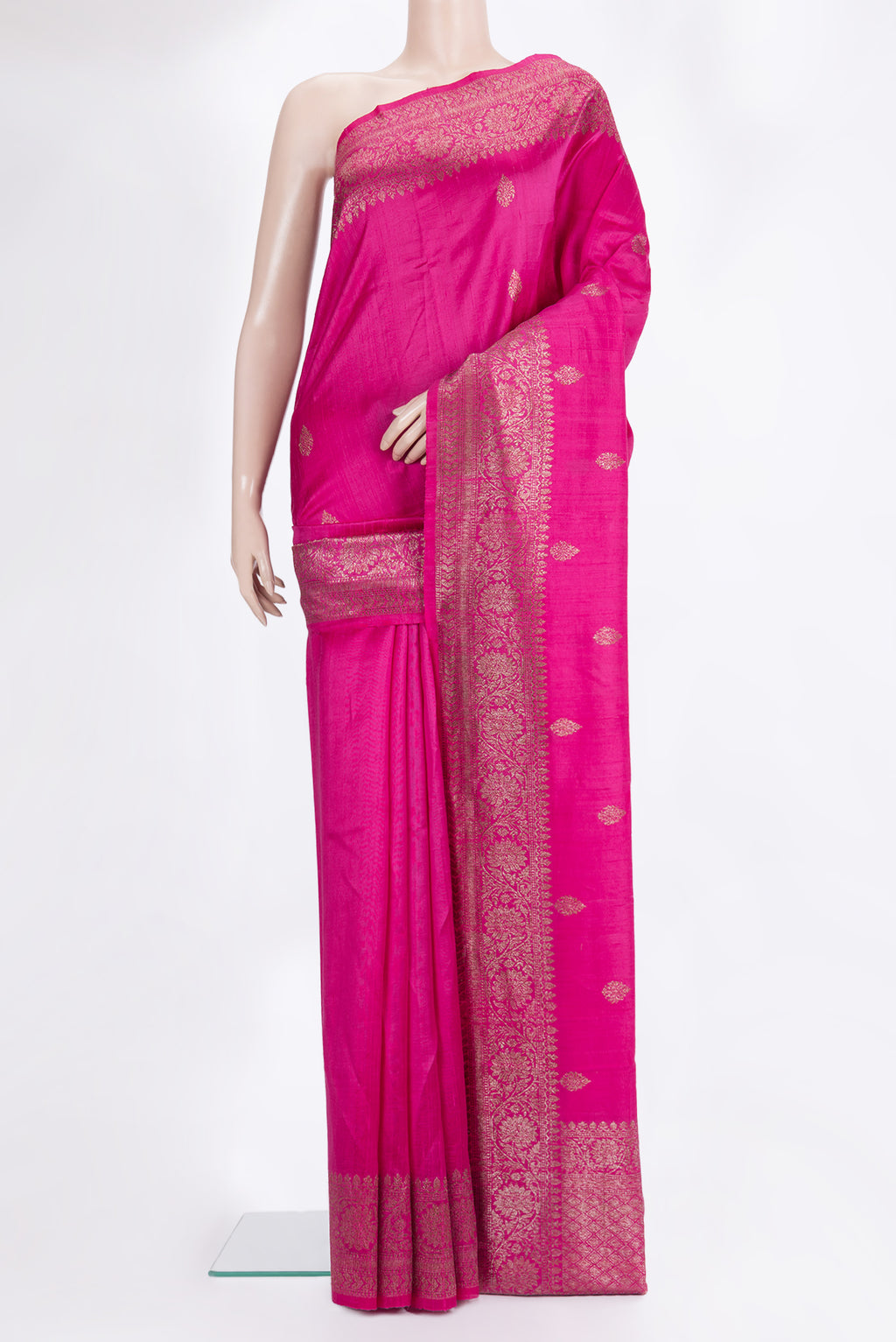 Dark Pink Raw Saree with Zari Butta on the body and Zari Border.  displayed on a mannequin