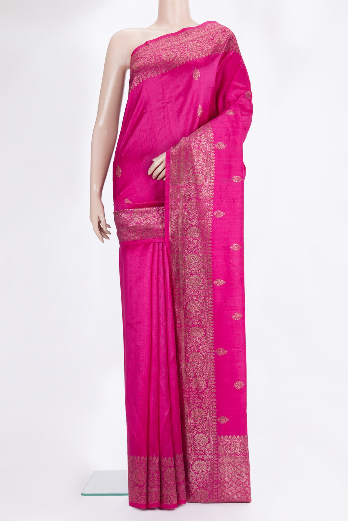 Dark Pink Raw Saree with Zari Butta on the body and Zari Border.  displayed on a mannequin