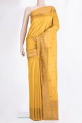 Mustard Raw Saree with Zari Butta on the body and Zari Border.  displayed on a mannequin
