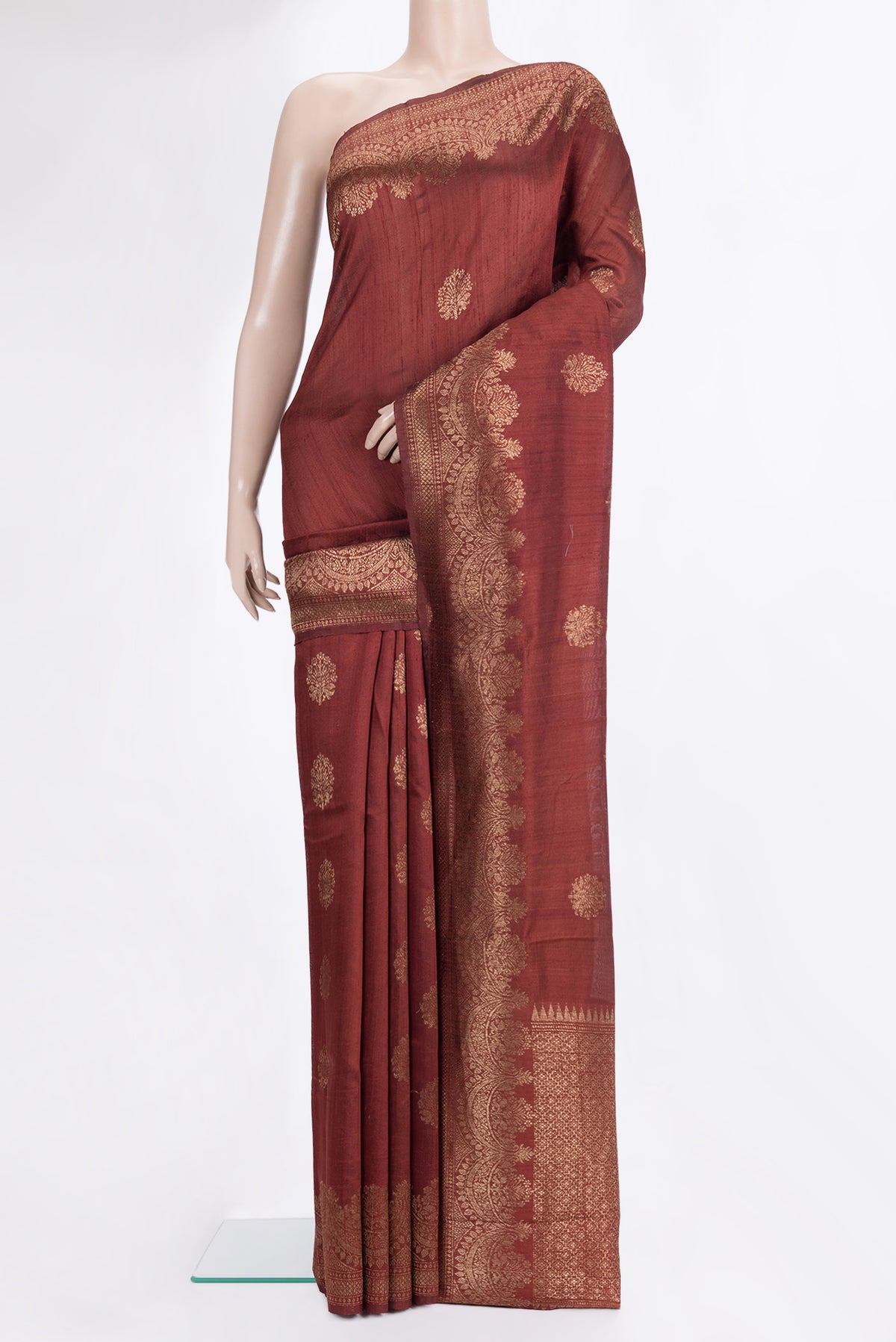 Brown Dual Tone Raw Saree with Zari Butta on the body and Zari Border.  displayed on a mannequin