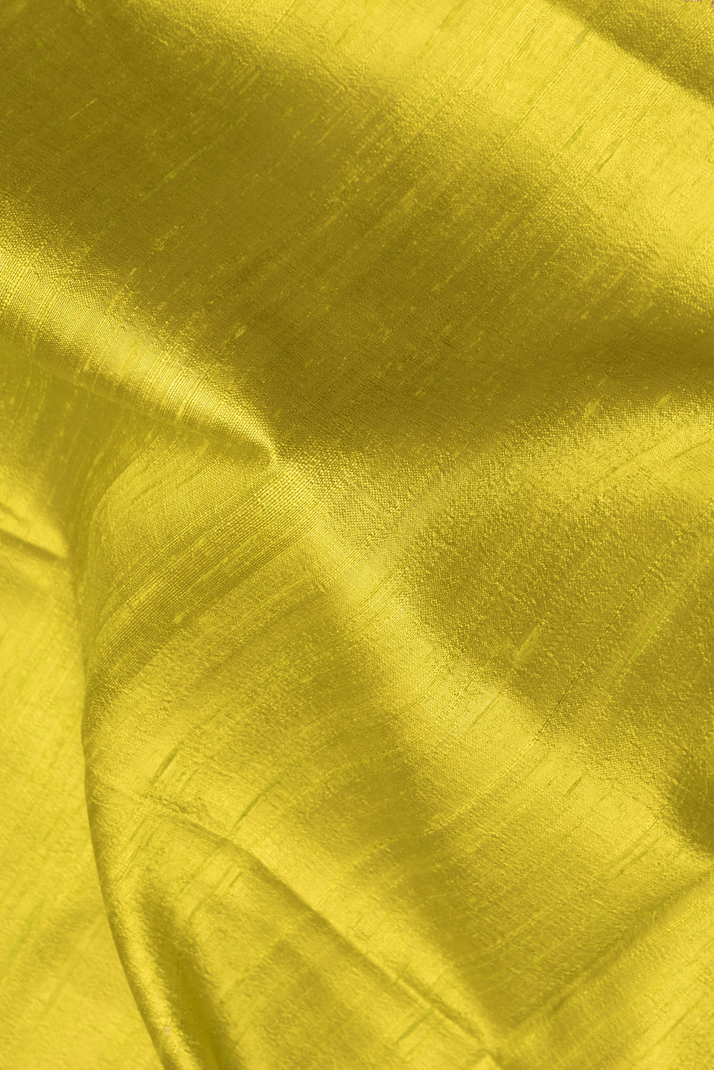 Close up of Mehandi Green Dual Tone Raw Saree with Plain Body and Zari Border.  displaying folds