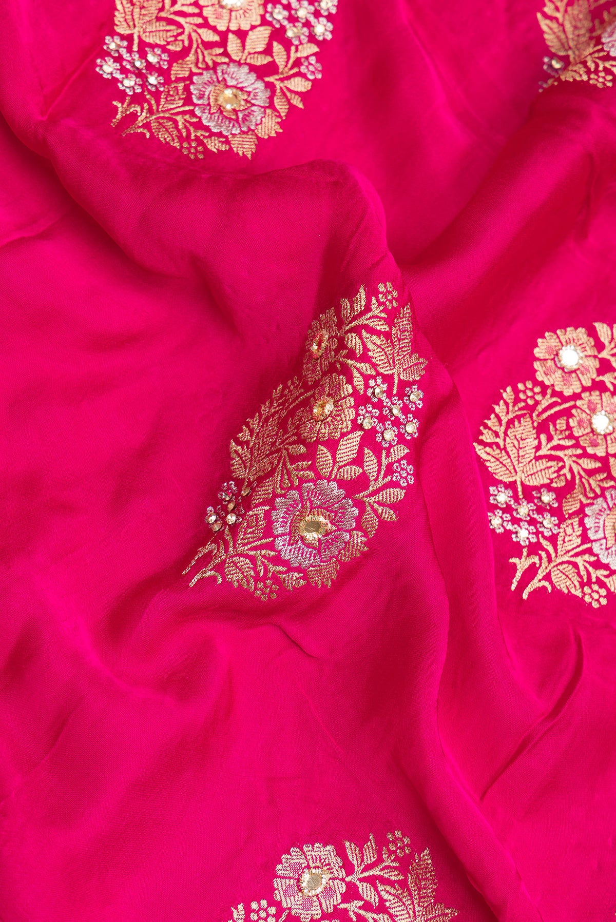 Close up of Dark Pink Satin Saree with Embroidered on the body and Sequin Border.  displaying folds