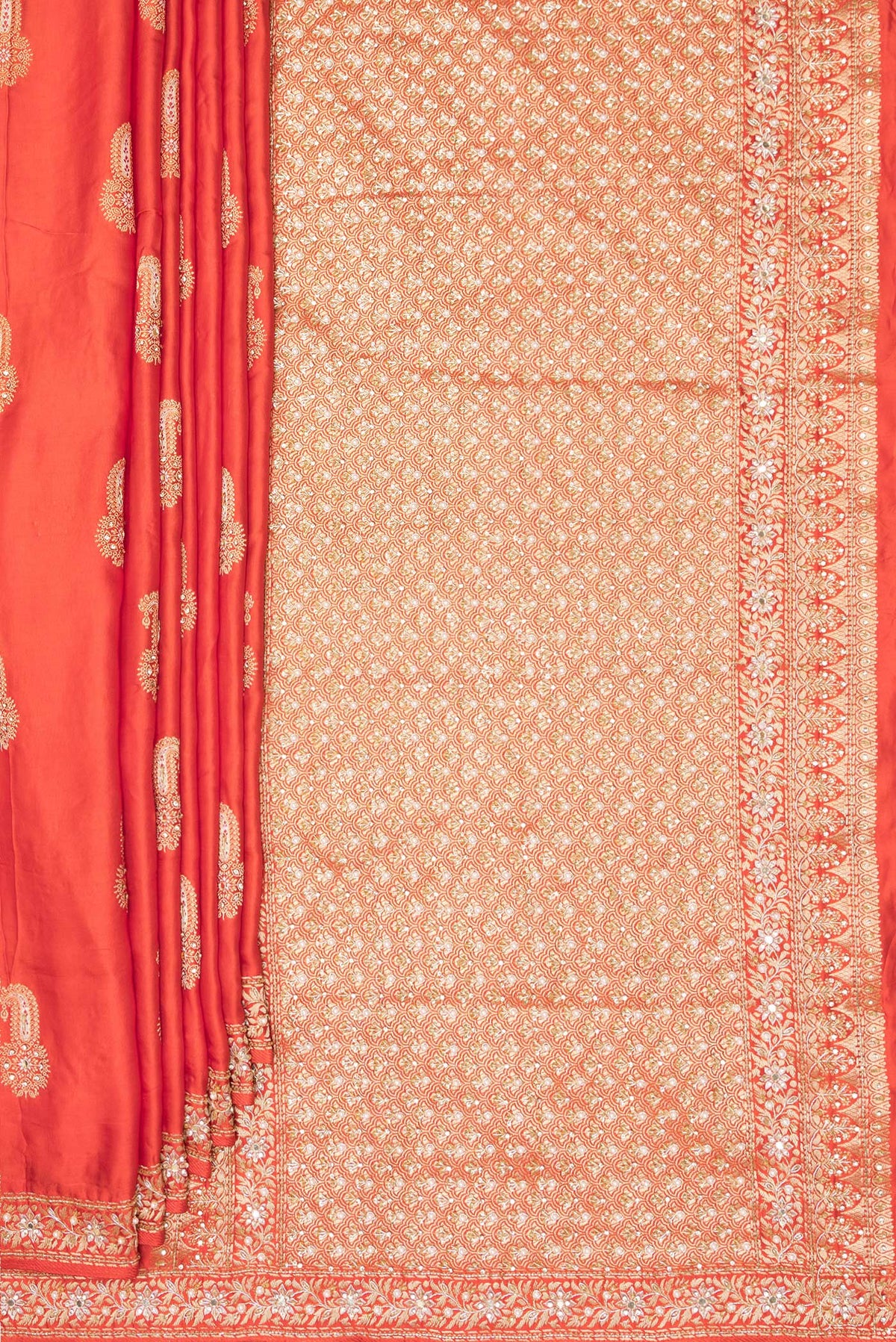 Pleats and pallu of Brick Orange Satin Saree with Embroidered on the body and Sequin Border. 
