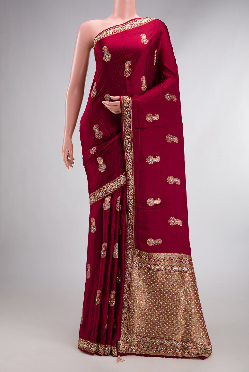 Maroon Satin Crepe Saree with Embroidered on the body and Sequin Border.  displayed on a mannequin
