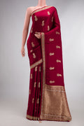 Maroon Satin Crepe Saree with Embroidered on the body and Sequin Border.  displayed on a mannequin