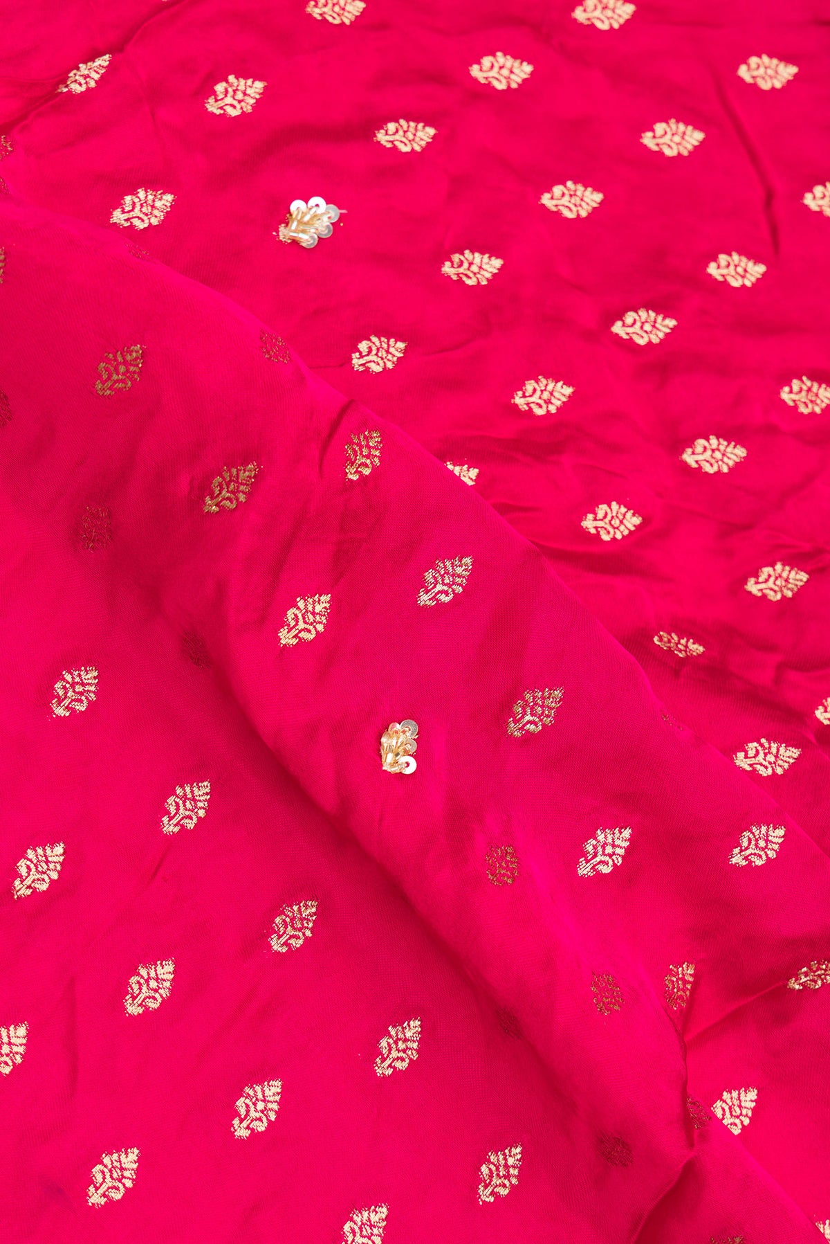 Close up of Dark Pink Satin Saree with Embroidered on the body and Sequin Border.  displaying folds