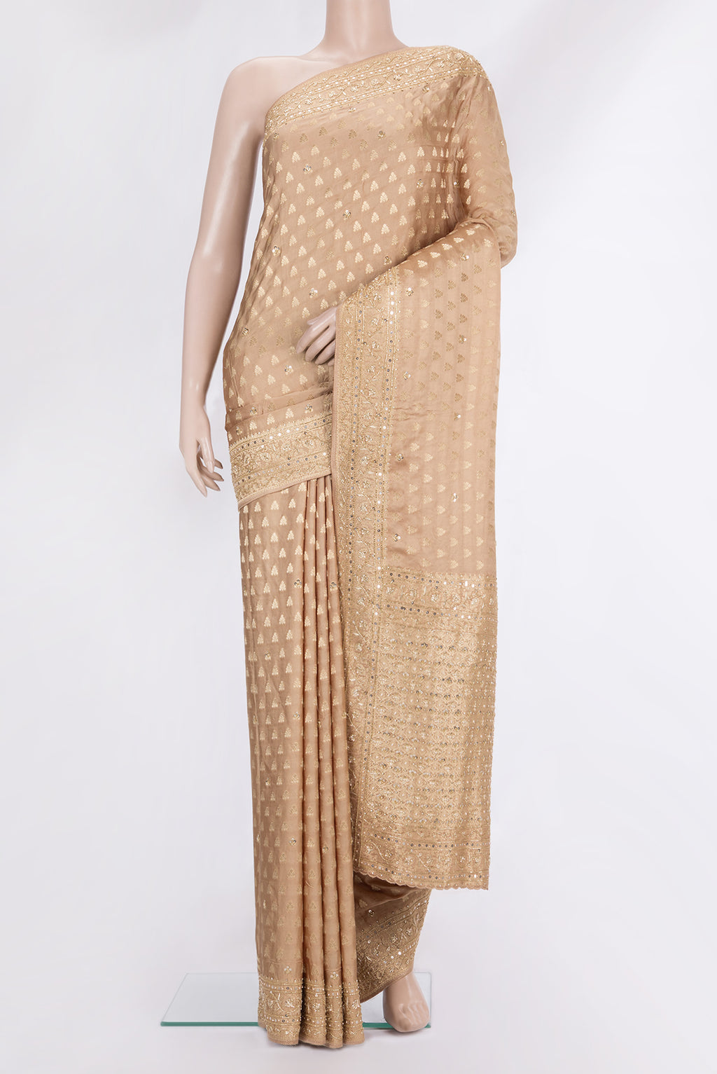Sandal Satin Saree with Embroidered on the body and Embroidered Border.  displayed on a mannequin